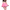 A vibrant pink latex skater skirt with a sharp black contrast trim, featuring a high-gloss finish by Dark Kulture.
